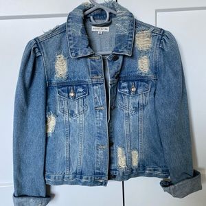 Distressed denim jacket with puffed sleeves